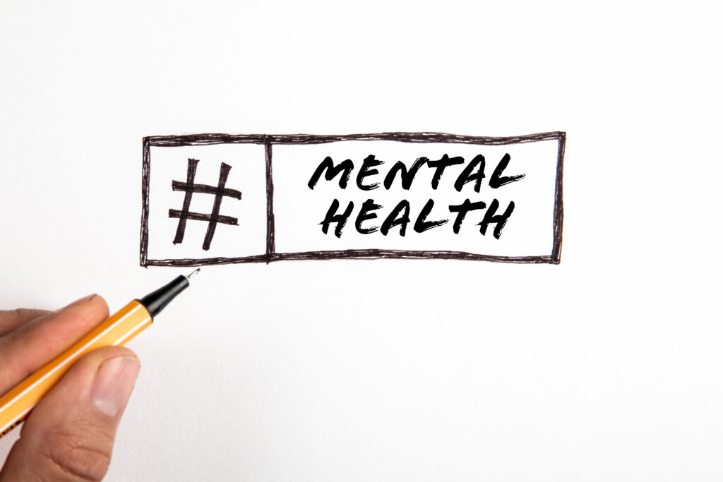 Mental health. Text and hashtag sign on white background.