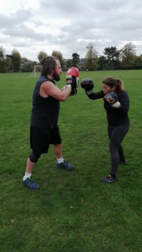 Alexia doing boxing (padwork)